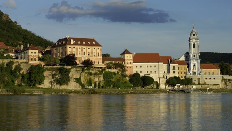 Exterior view of Dürnstein with castle and church on the riverbank.