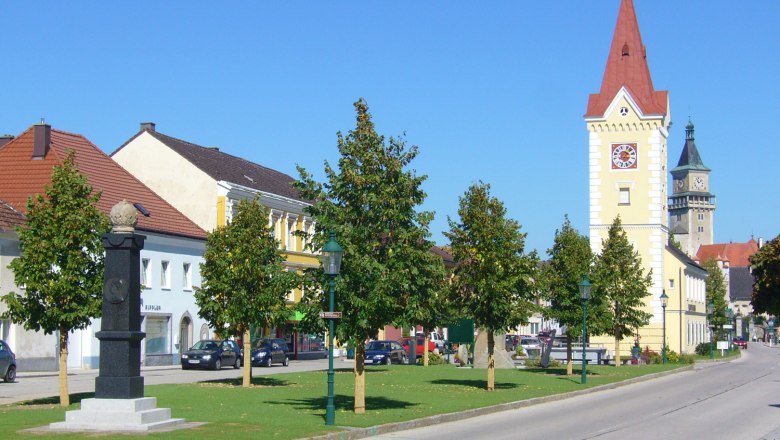 City center with tower and castle in the background.