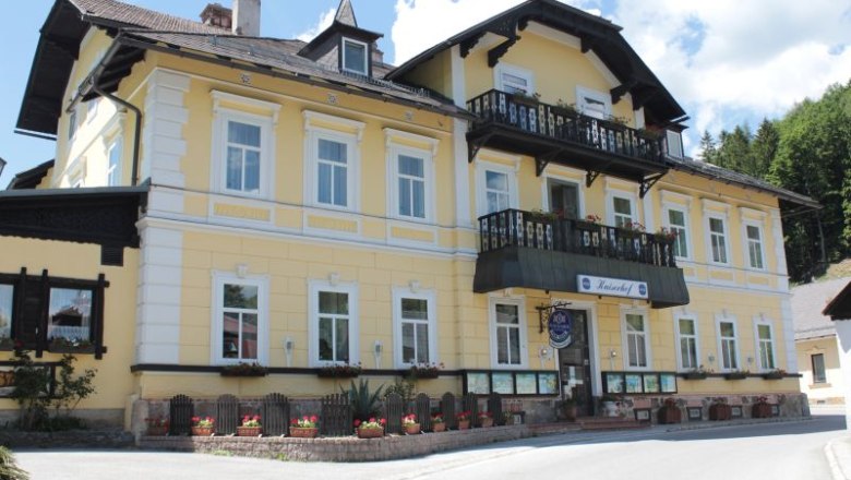 Yellow building with balcony and flower boxes, Land-Pension Kaiserhof.