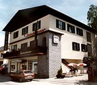 A two-story building with a balcony and terrace, labeled 'Steinbrunner'.