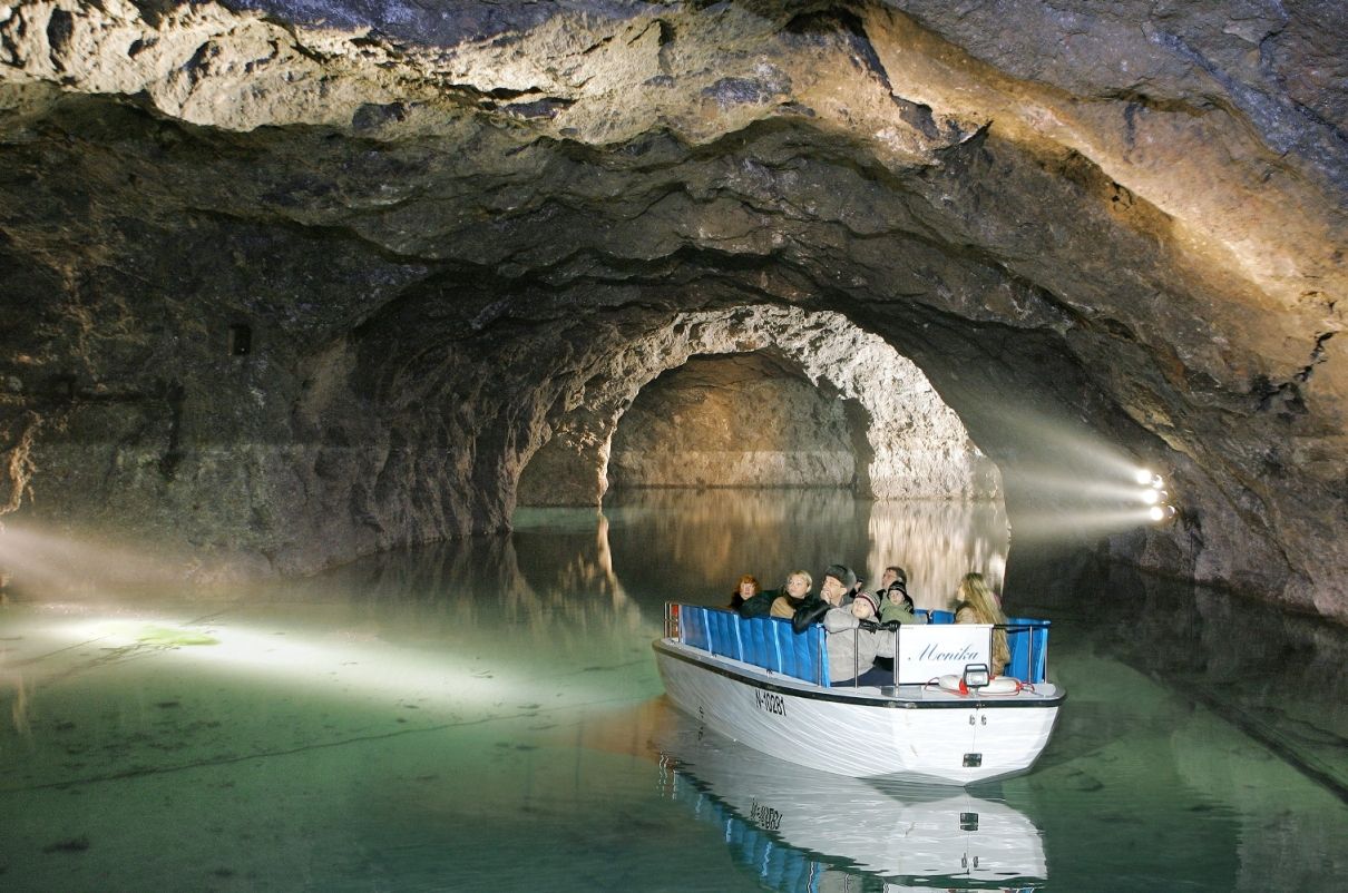 Boat trip in the Hinterbrühl lake grotto, illuminated cave.