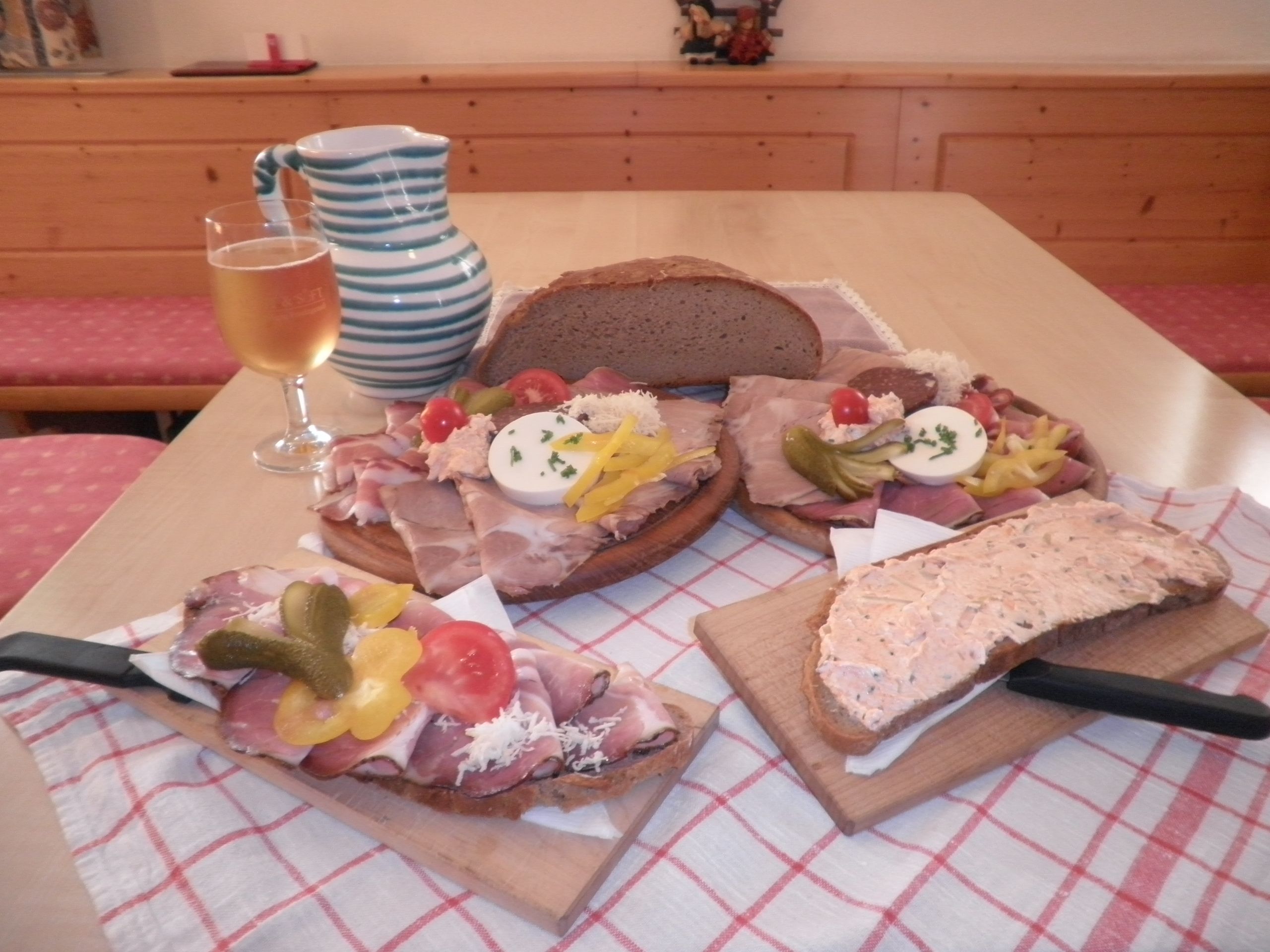 Traditional Austrian snack with bread, cold cuts and a drink.
