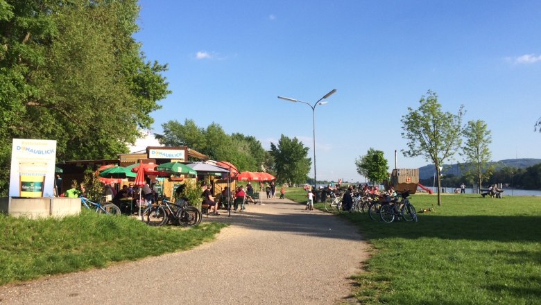 Cycle path with snack bar and bicycles along the Danube.