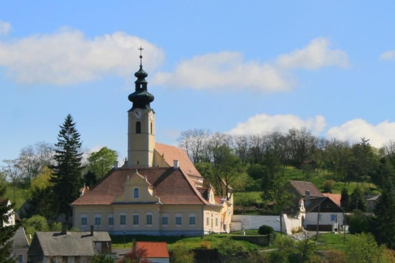 Church in a rural setting with a blue sky.