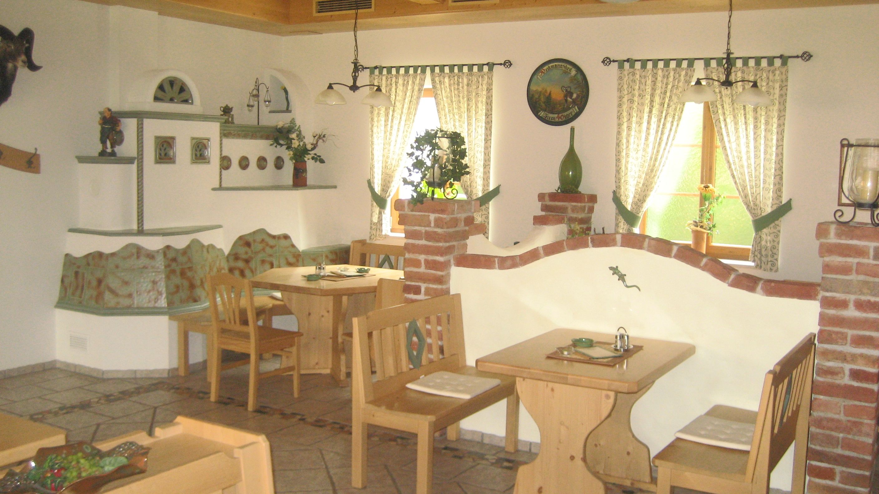 Cozy interior of a wine tavern with wooden furniture and decorative elements.