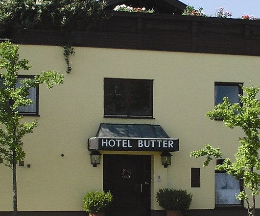 Hotel, © Hotel Josef Butter Facade of a building with the sign 'Hotel Butter'.