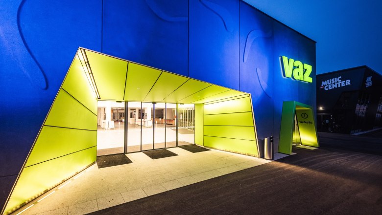 Entrance to the VAZ St. P&ouml;lten with illuminated sign and modern architecture.