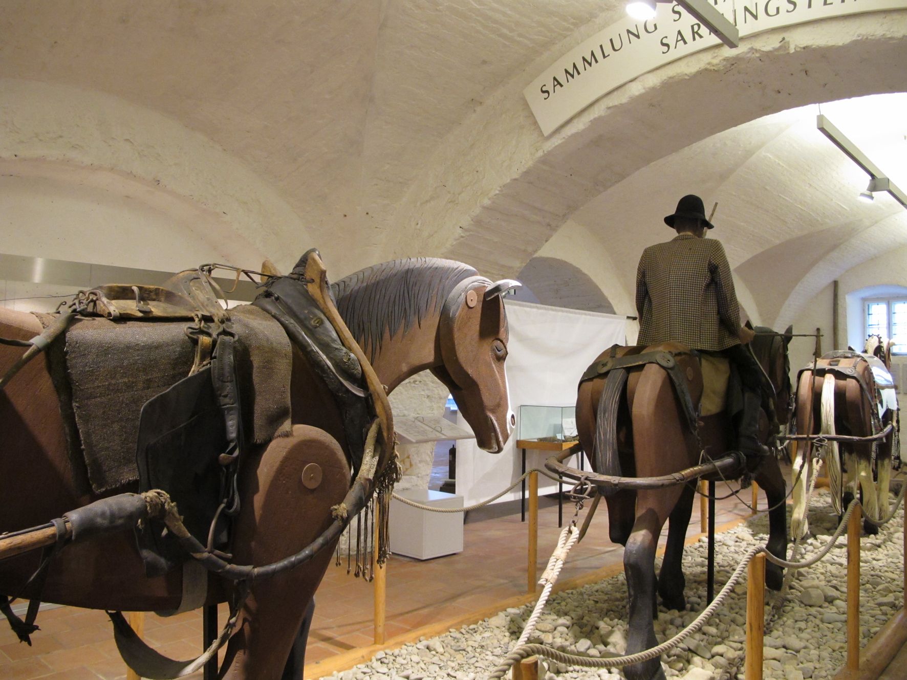 Exhibition in the Spitz Maritime Museum with horse figures and riders.