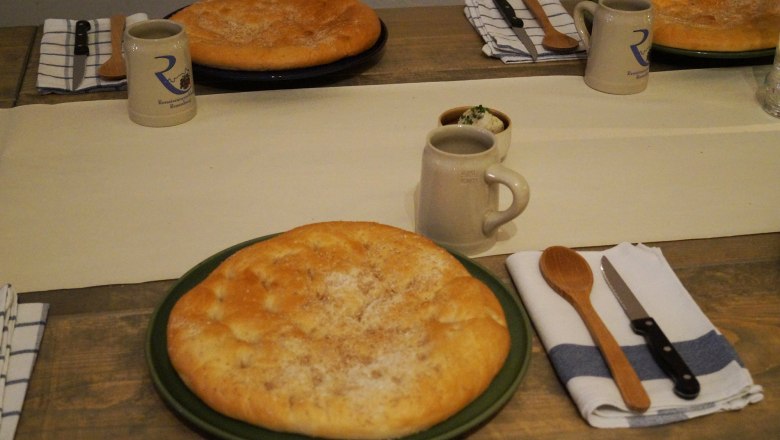Table laid with bread, jugs and cutlery at Rosenburg Castle.
