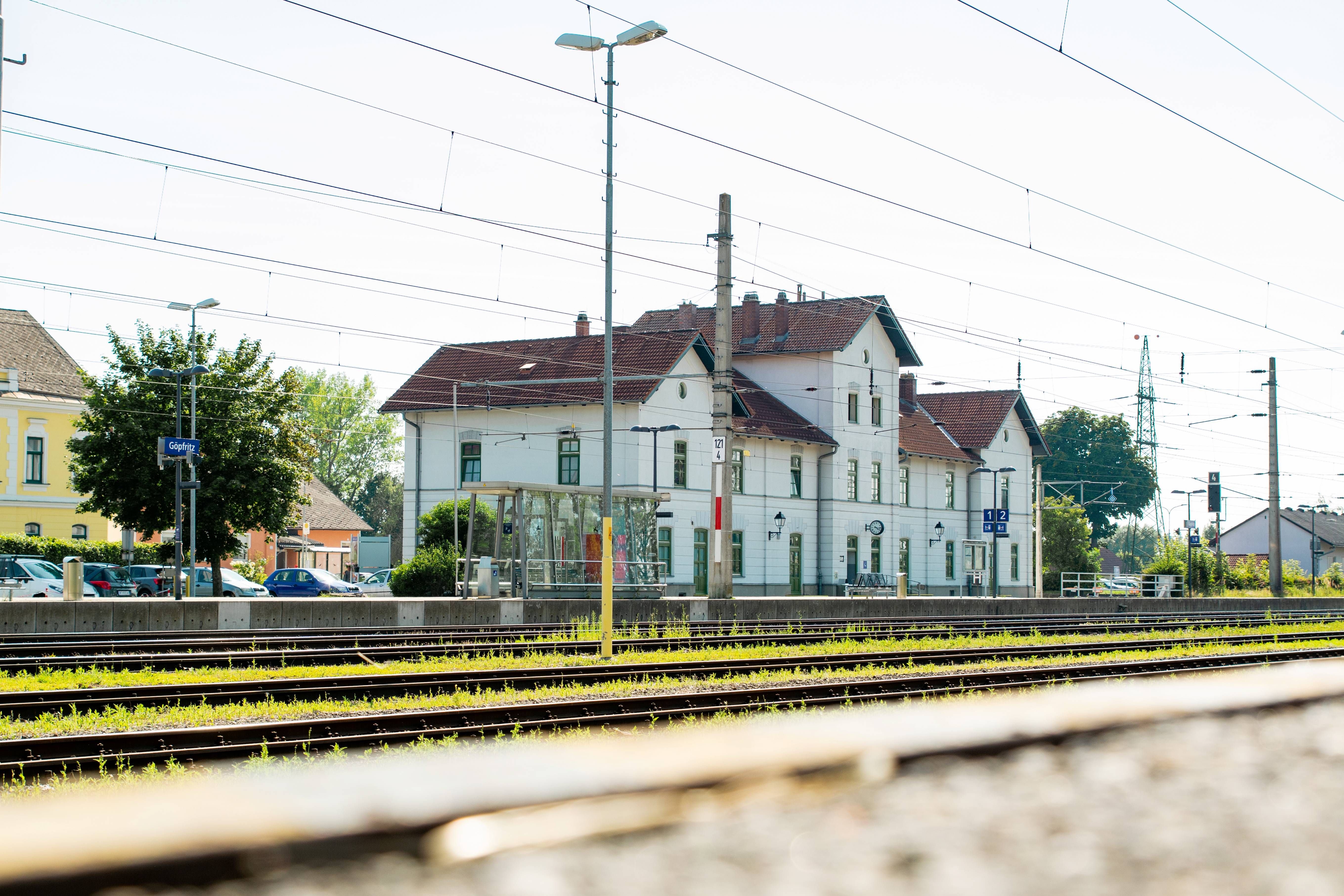 Rails in front of a white station house