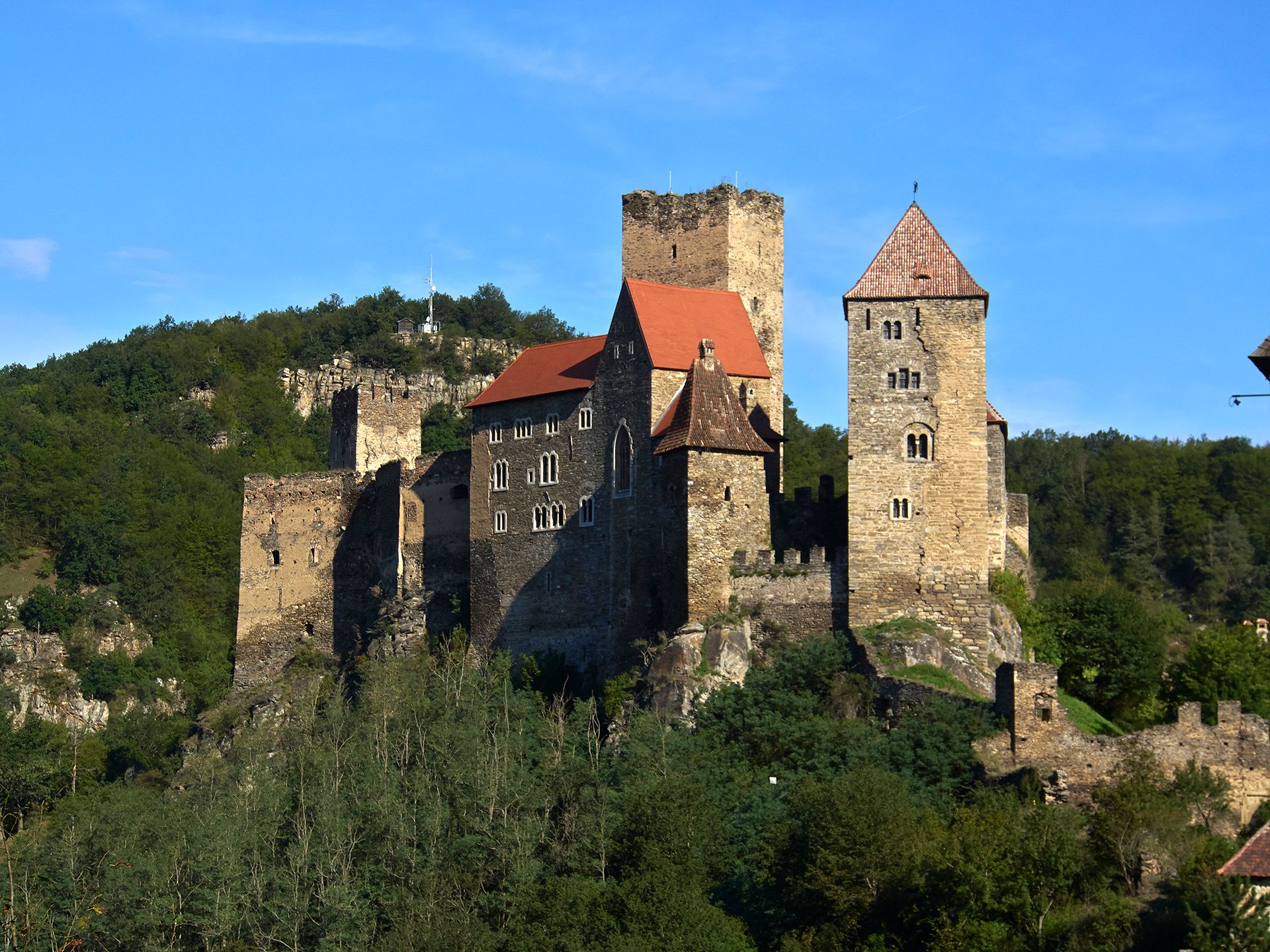 Hardegg Castle in a green landscape under a clear sky.