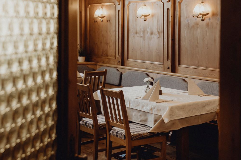 Cozy dining room with wooden furniture and table decorations.