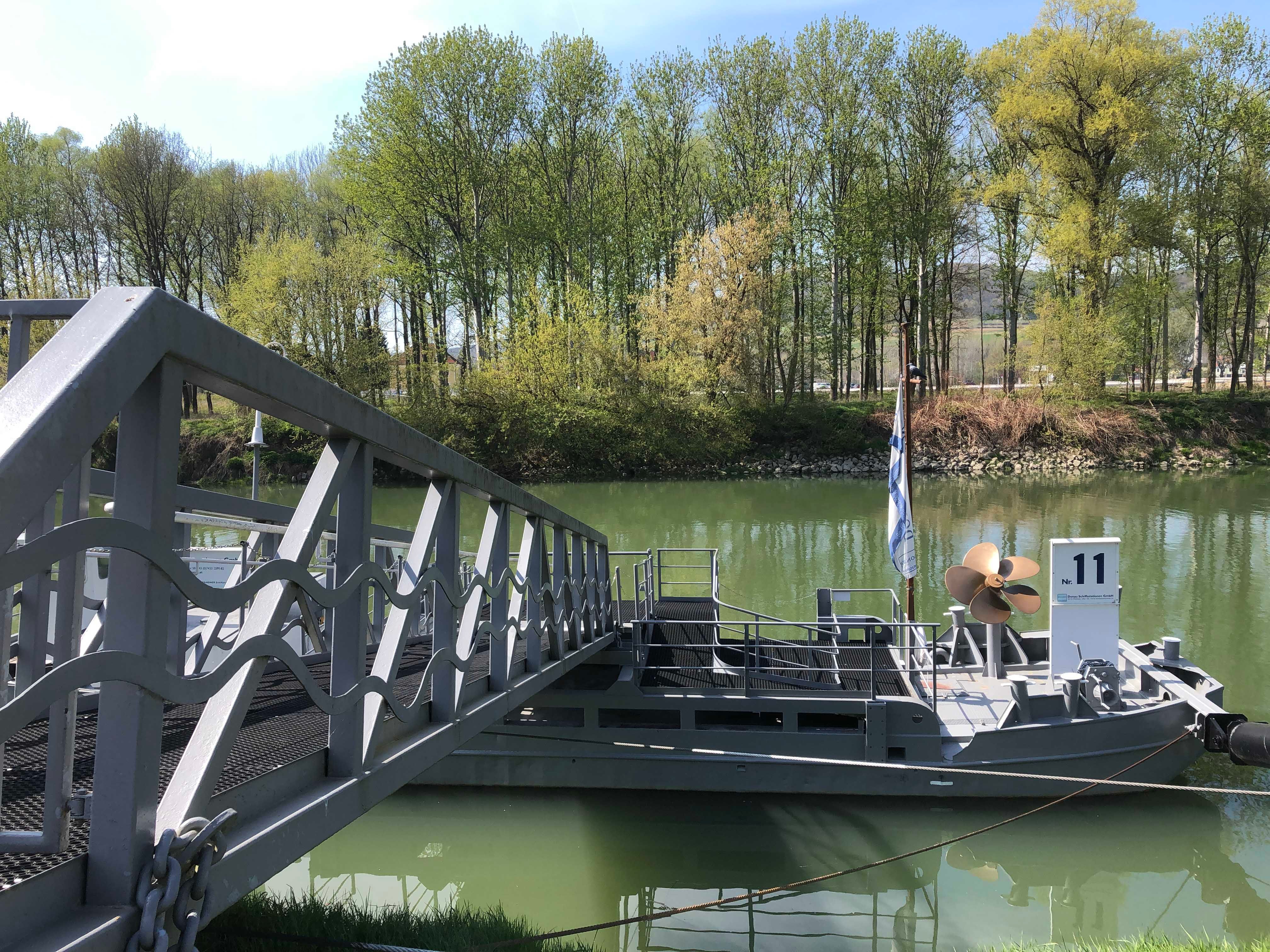 Mooring with boat and trees in the background.