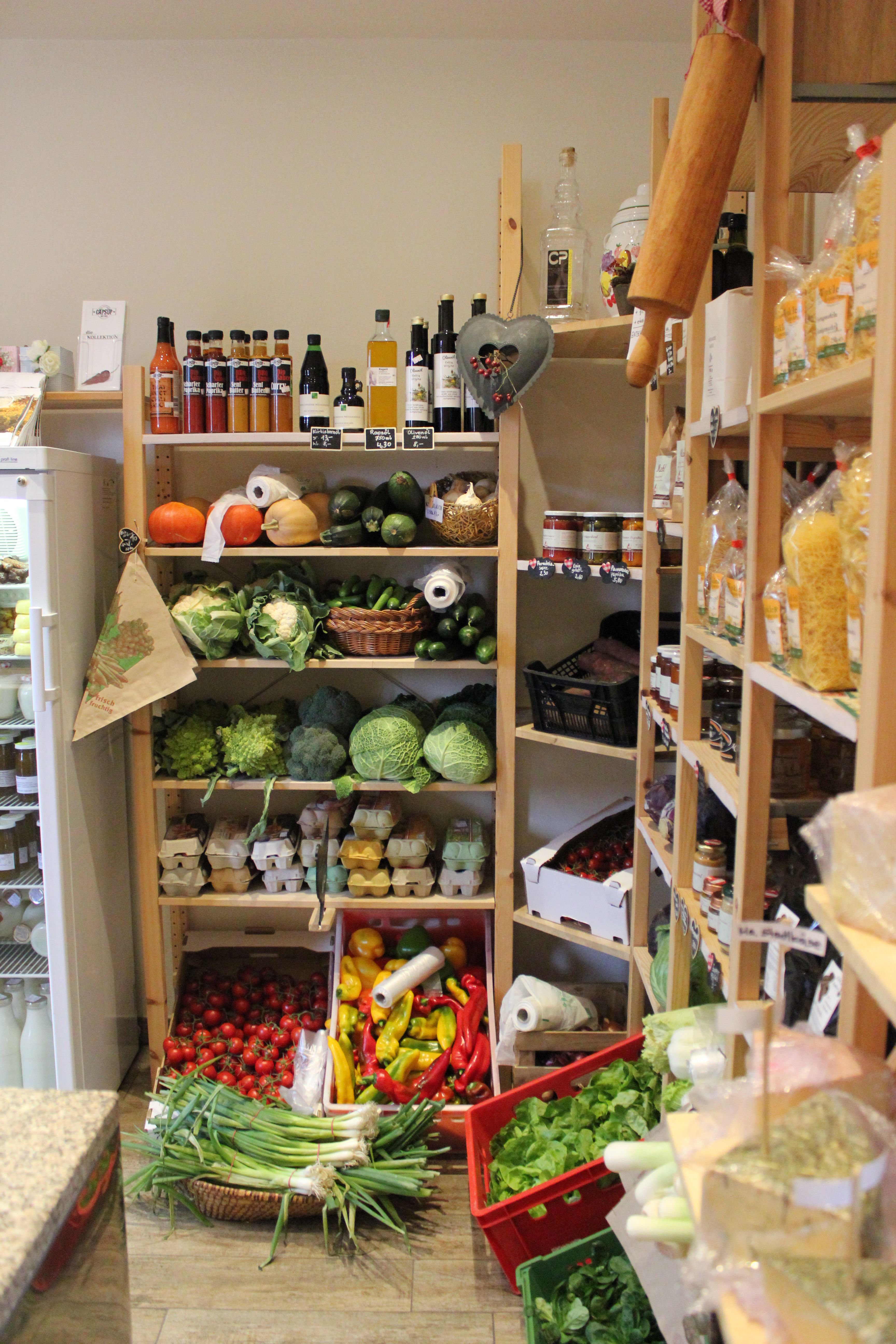 Landhof Laden Kittsee, product shelf with vegetables, eggs, juices etc.