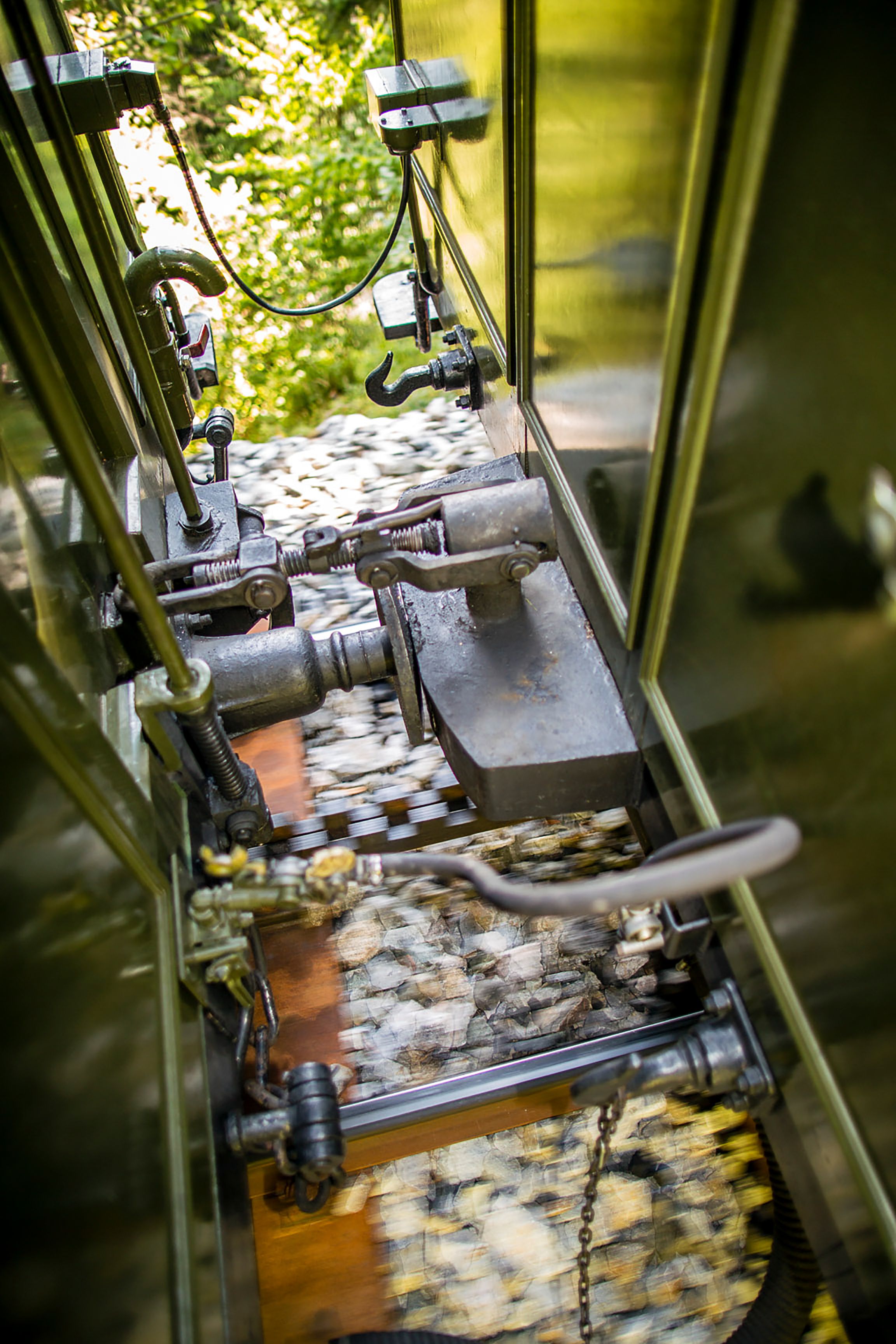 Close-up of a screw coupling between two railroad cars.