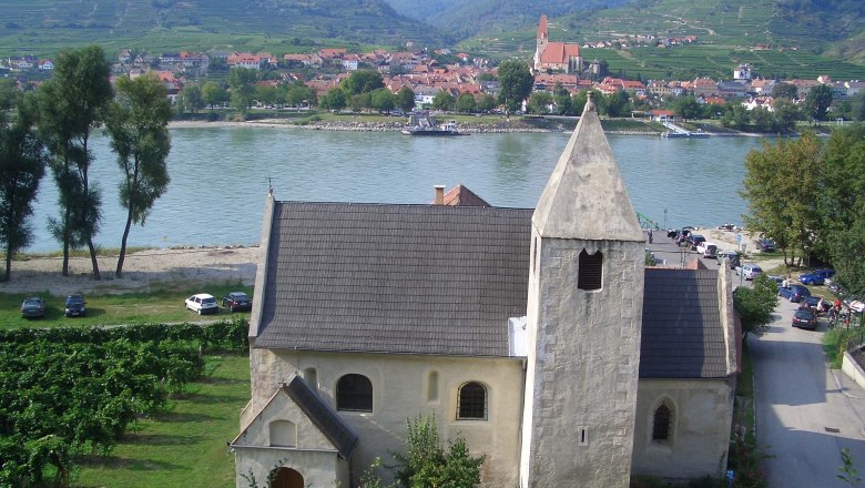 St. Lawrence church with river and village in the background.