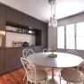 Modern kitchen with dining table, chairs and hanging lamp.