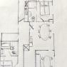 Hand-drawn sketch of an apartment floor plan on squared paper.