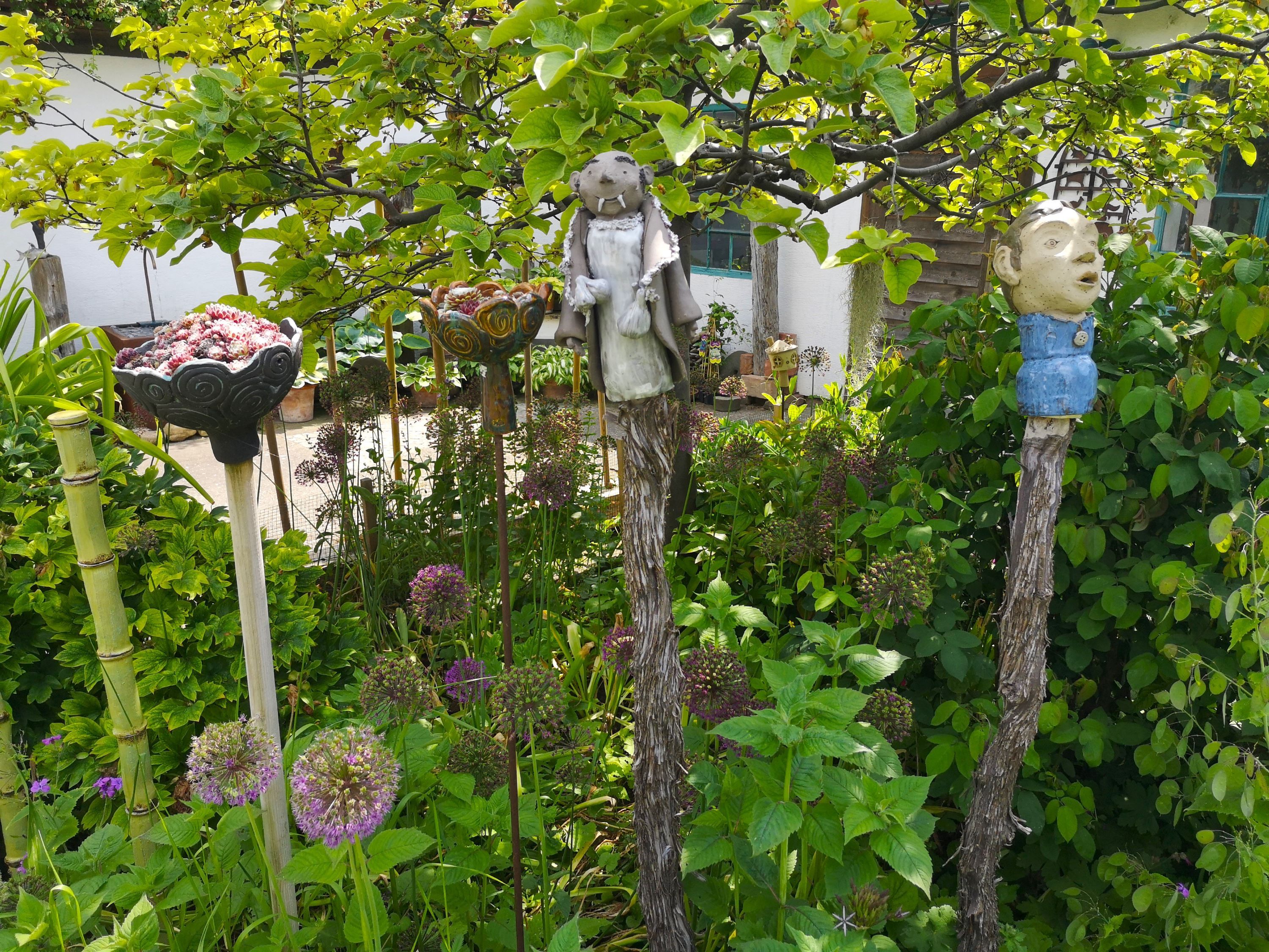 Garden with sculptures and plants