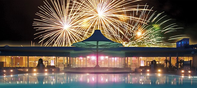 Fireworks over the Therme Laa at night.