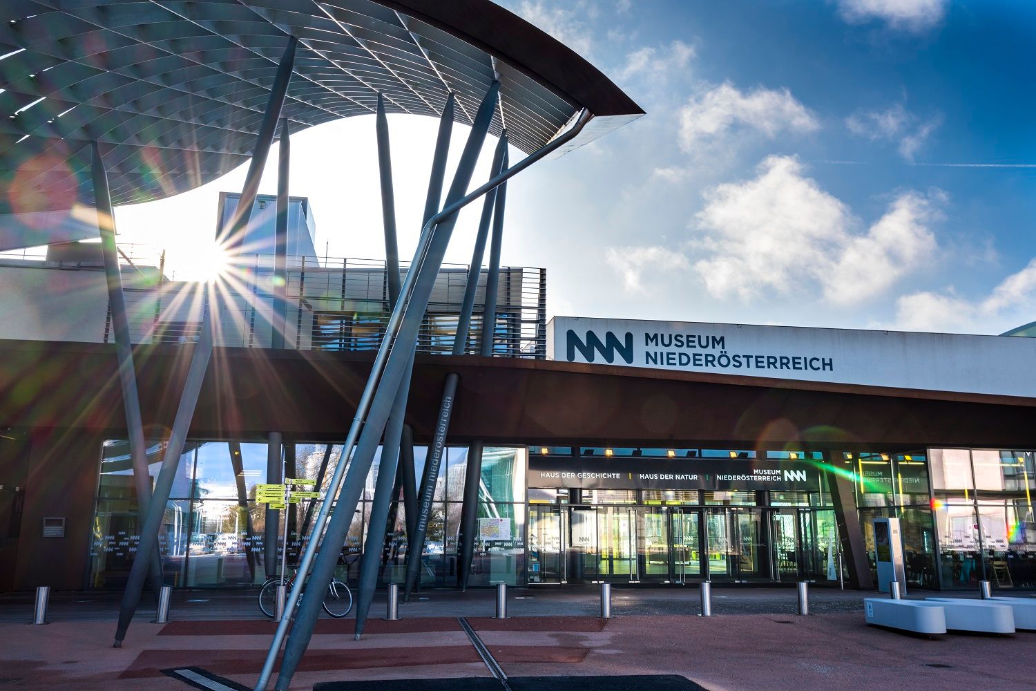 Entrance to the Museum Niederösterreich with modern architecture and rays of sunshine.
