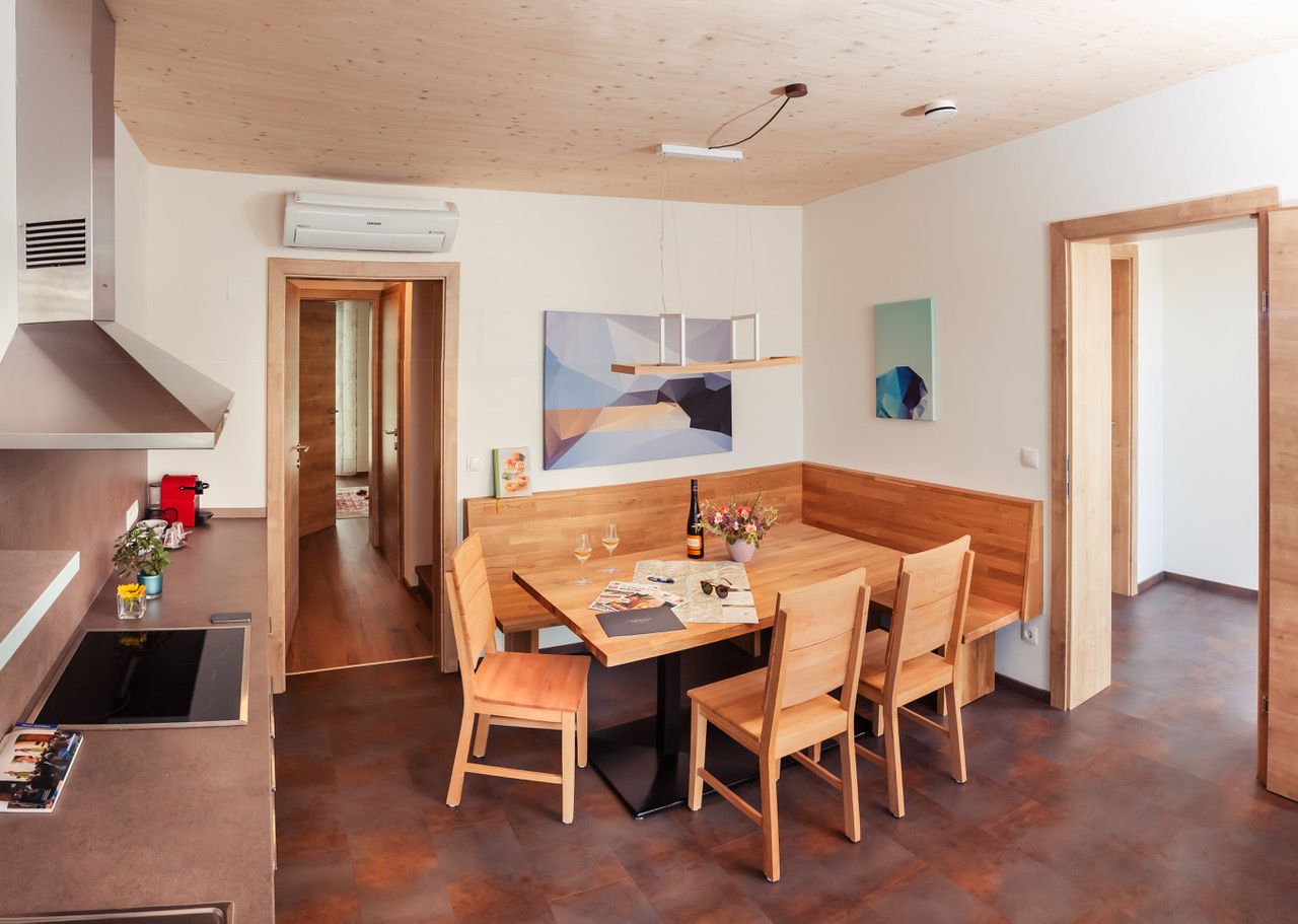Modern dining area in the chalet with wooden furniture and art on the walls.