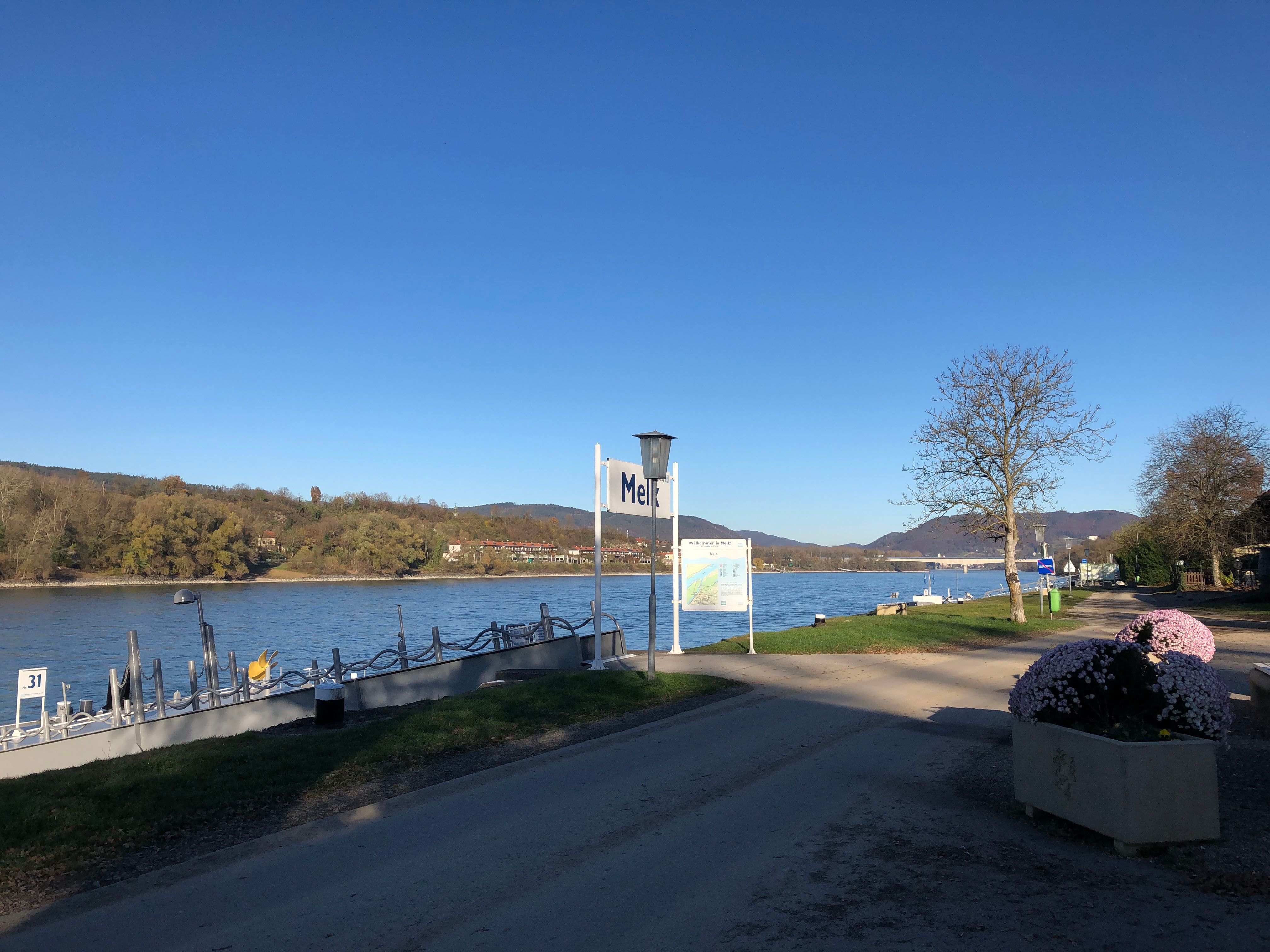 Pier no. 31 in Melk on a sunny day with a view of the Danube and the surrounding countryside.