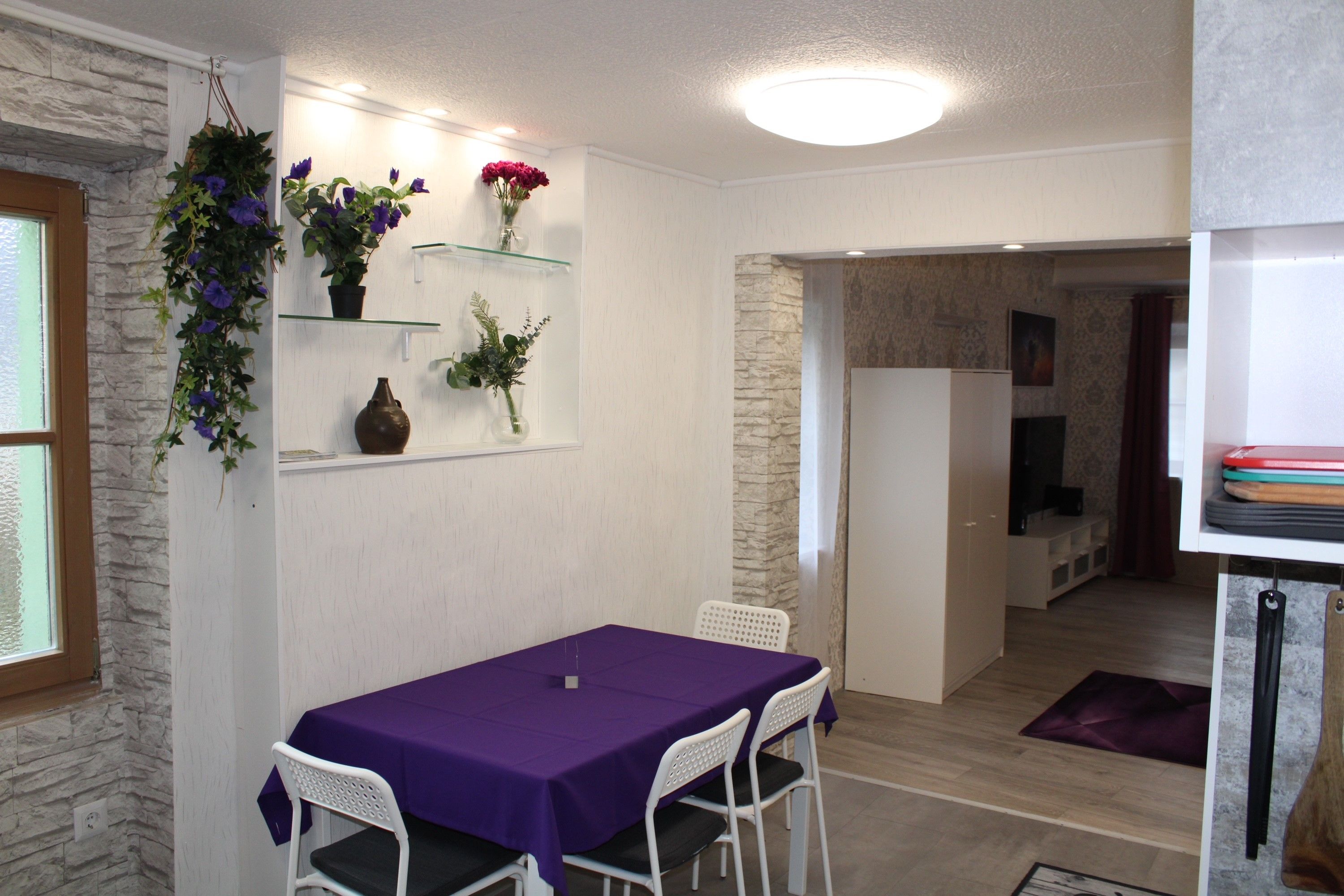 Purple table with white armchairs