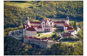 Aerial view of Göttweig Abbey in Austria, surrounded by forest.