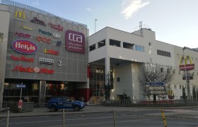 Shopping center City Center Amstetten with logos of stores and McDonald's sign.