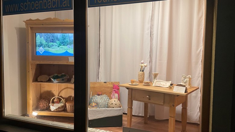 Shop window with tourist information and handmade products.