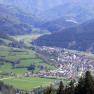 Panoramic view of the village of Türnitz, surrounded by green hills and forests.
