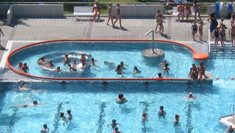 People swim and relax in a whirlpool at the Stockerau recreation center.