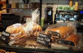 Bakery display with Guglhupf and poppy seed and nut strudel.