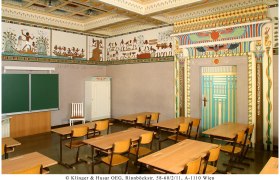 Egyptian-style classroom with murals and decorative door frame.