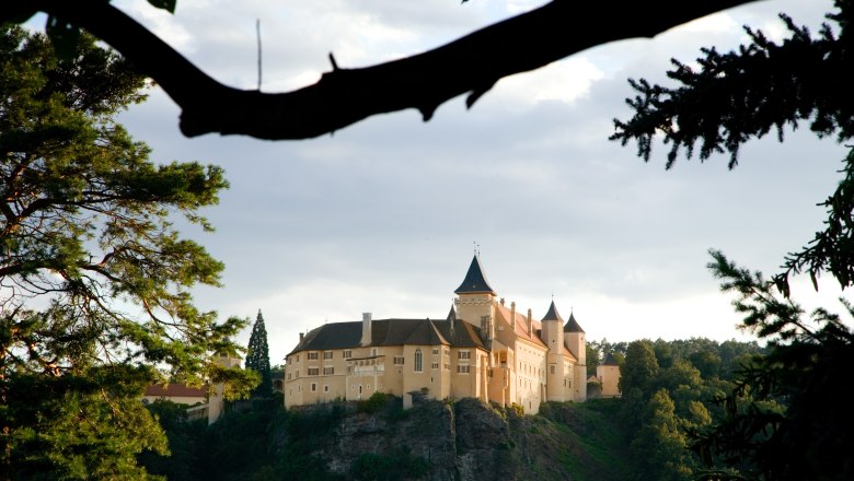 Renaissance Rosenburg Castle on a hill surrounded by trees.