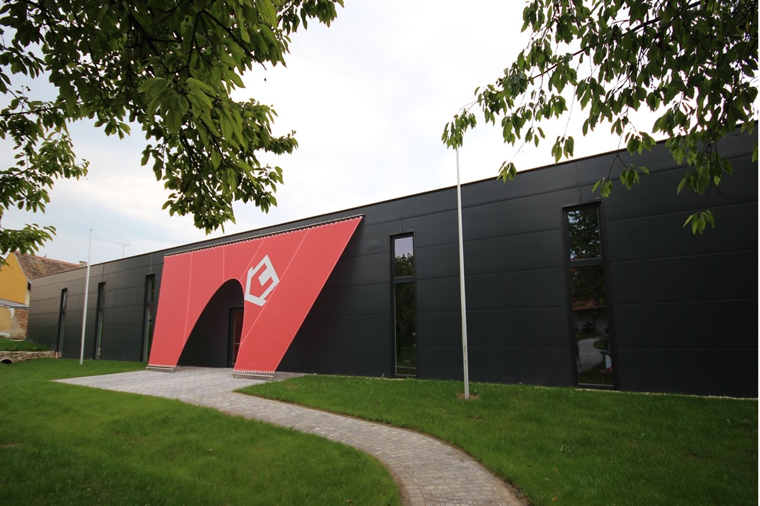 Exterior view of the Nonseum with modern design and red entrance.