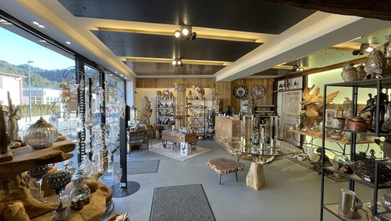 Interior view of a decoration store with wood and glass elements.