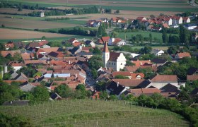 Aerial view of Inzersdorf with parish church and surrounding houses.