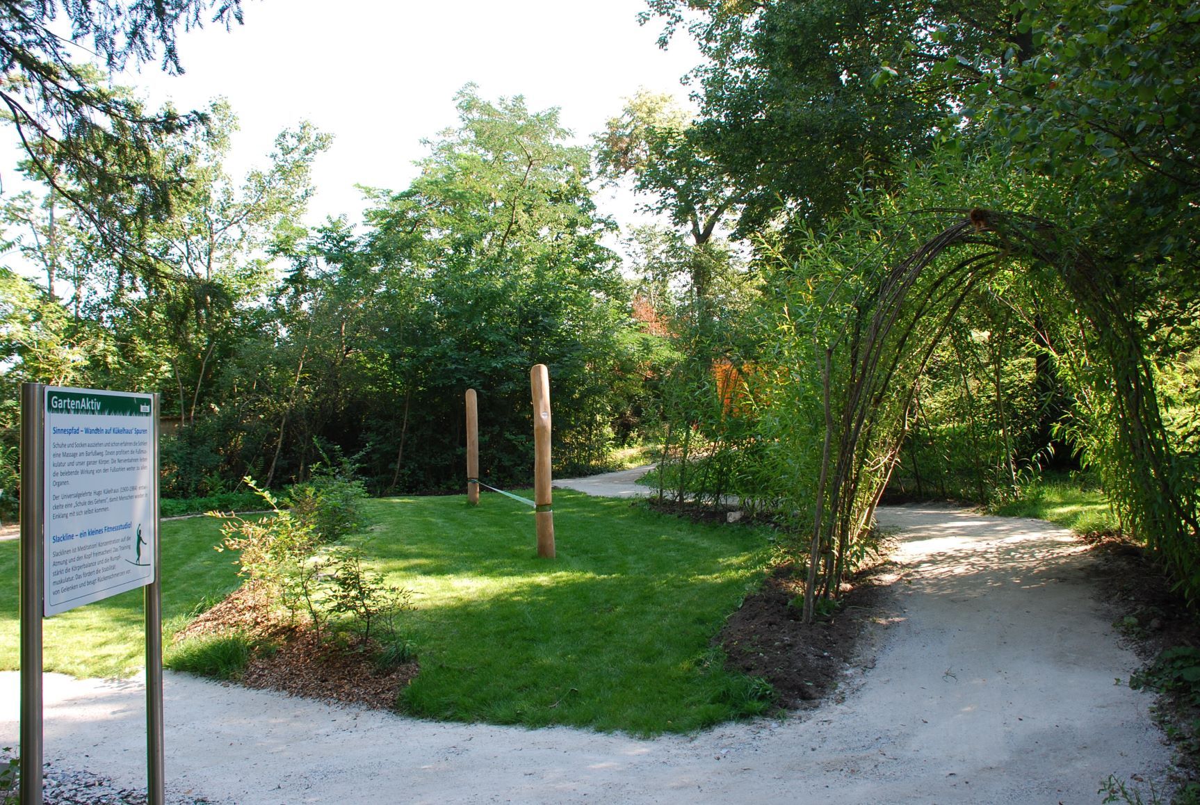 Therapy garden with winding paths and green vegetation at Schiltern Castle.