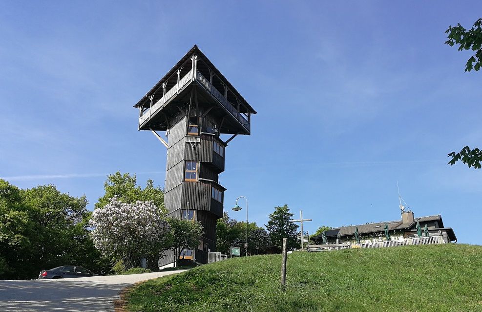 Buchbergwarte tower on a hill with blue sky in the background.