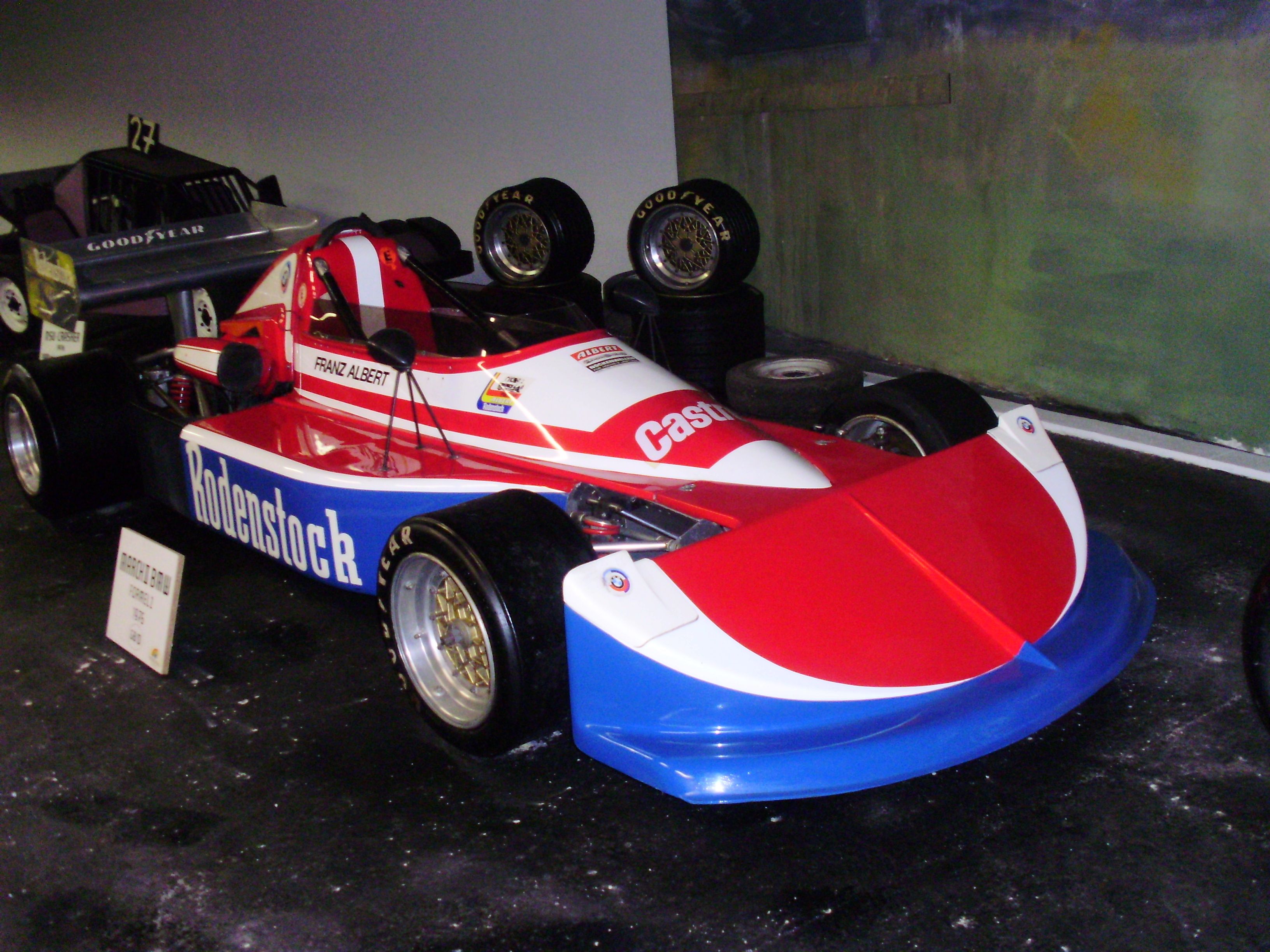 A red and white racing car with the inscription 'Rodenstock' in the Aspang Automobile Museum.