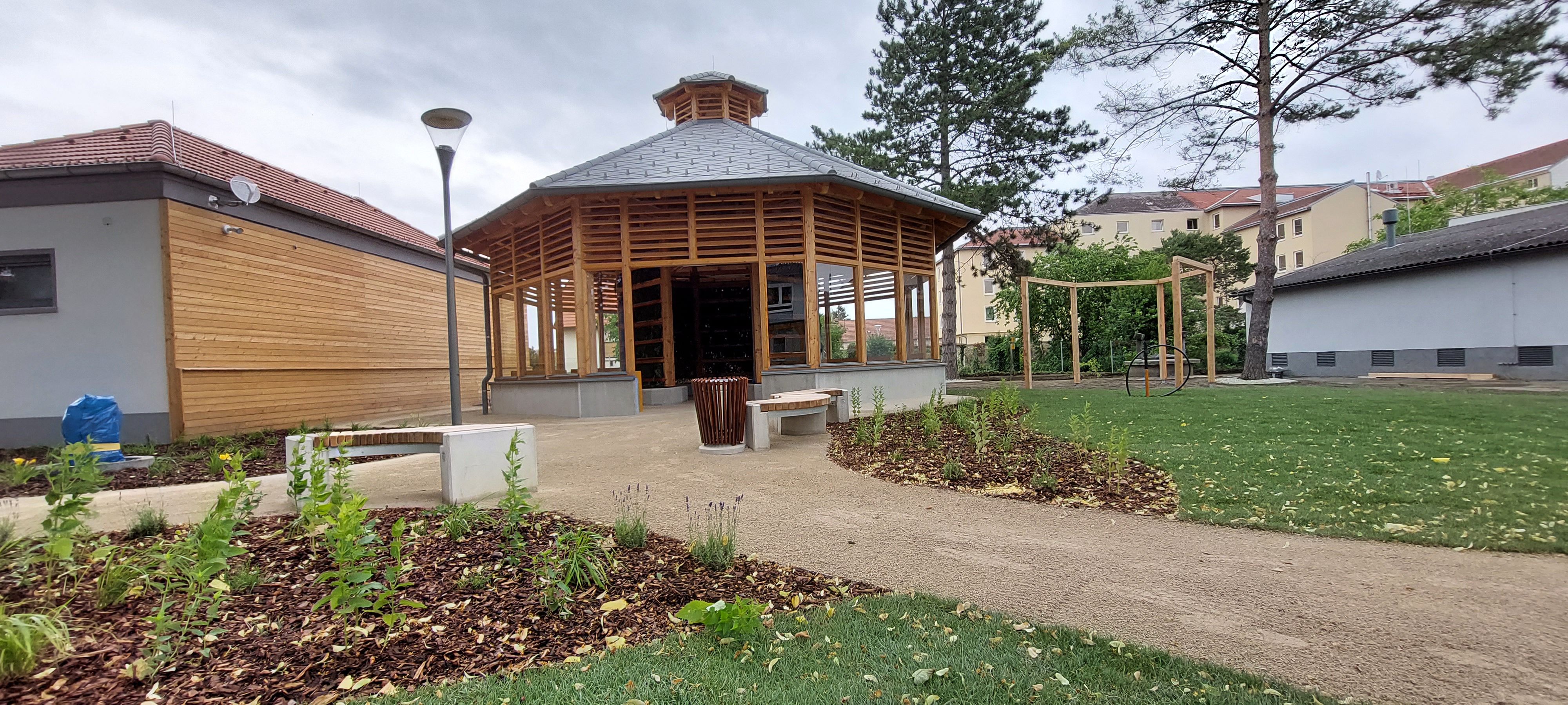 A modern inhalatorium with wooden construction and garden.