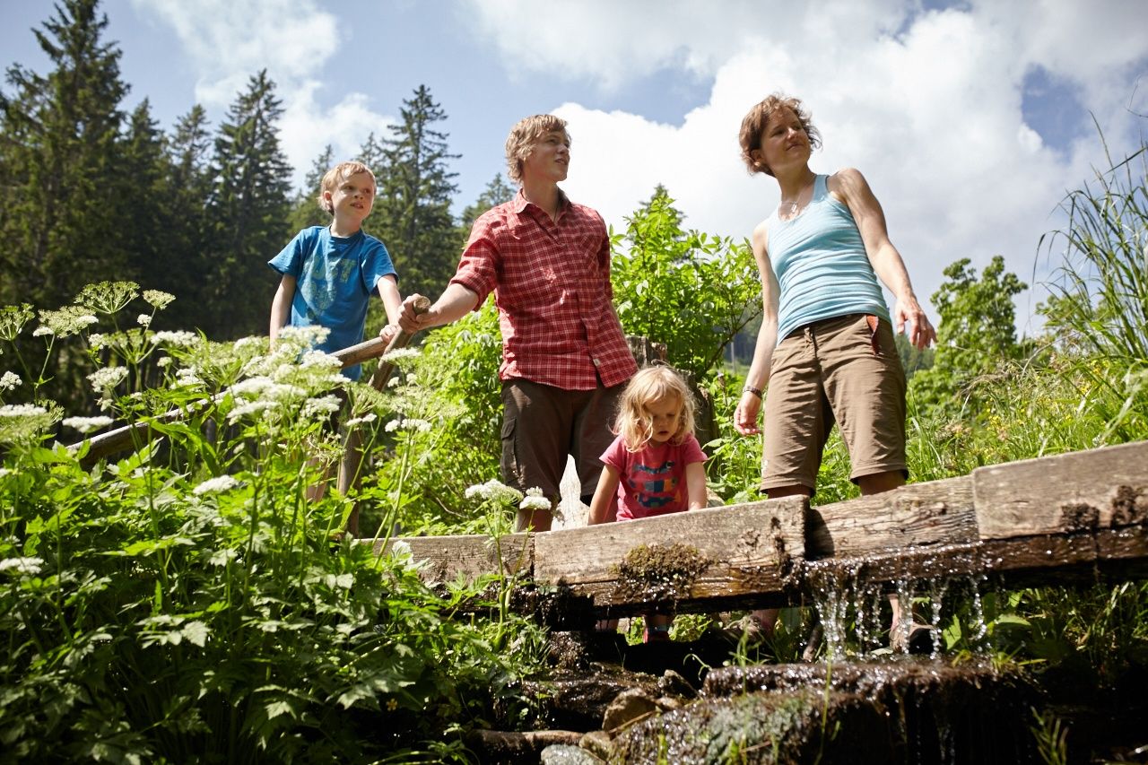 Family hike on the white water theme trail