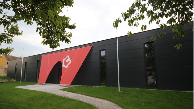 Exterior view of the Nonseum with modern design and red entrance.