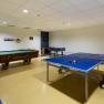 Recreation room with pool table, table tennis table and table soccer in the City Hotel.