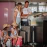 Family at the reception desk at HEINhotel vienna airport