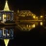 Christmas illuminated pavilion on the lake in Puchberg at night.