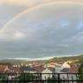 City view of Krems with rainbow in the sky.