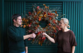 The owners of the winery at the entrance portal